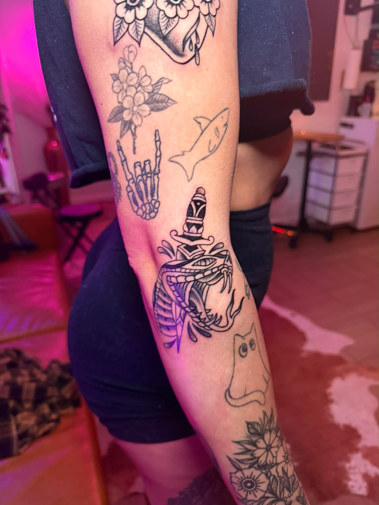 Arm by Jenna, traditional snake and dagger in black and grey