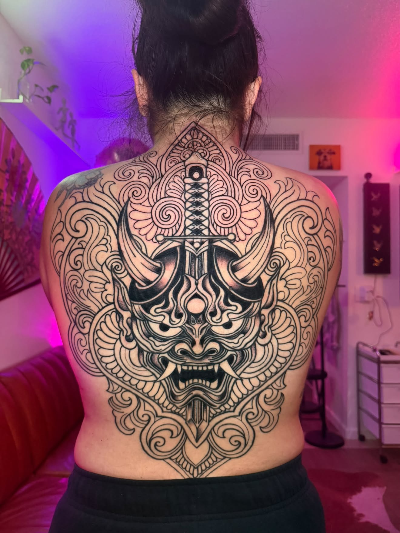 Back piece by Jenna, ornamental mask and dagger