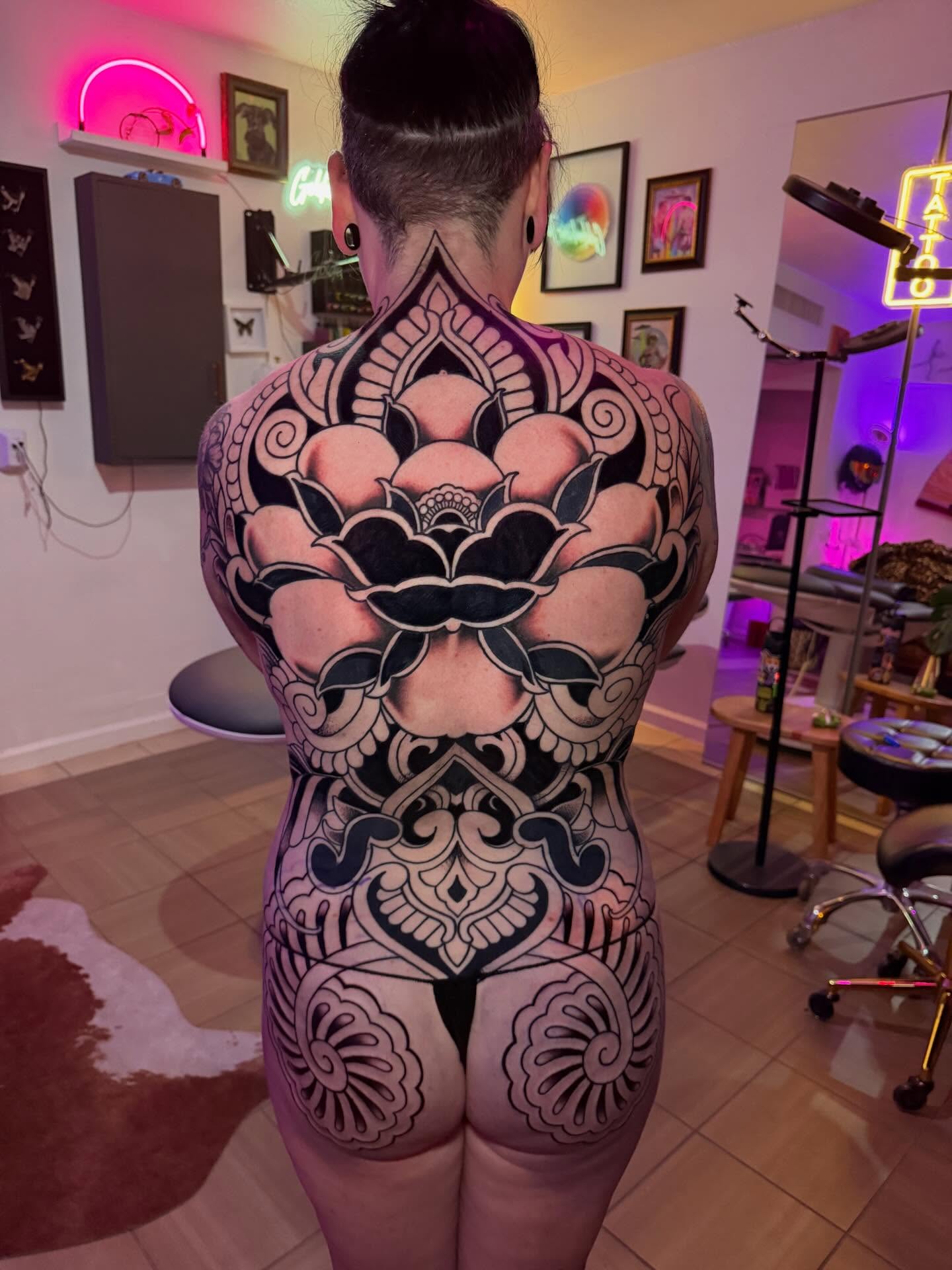 Full back piece by Jenna, bold black lotus and ornament