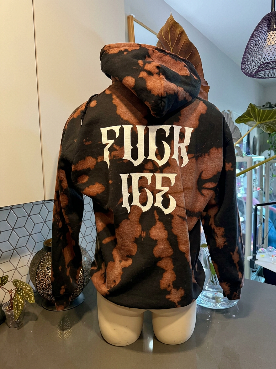 Bleach dyed black and brown pullover hoodie with a white gothic FUCK ICE print on the back